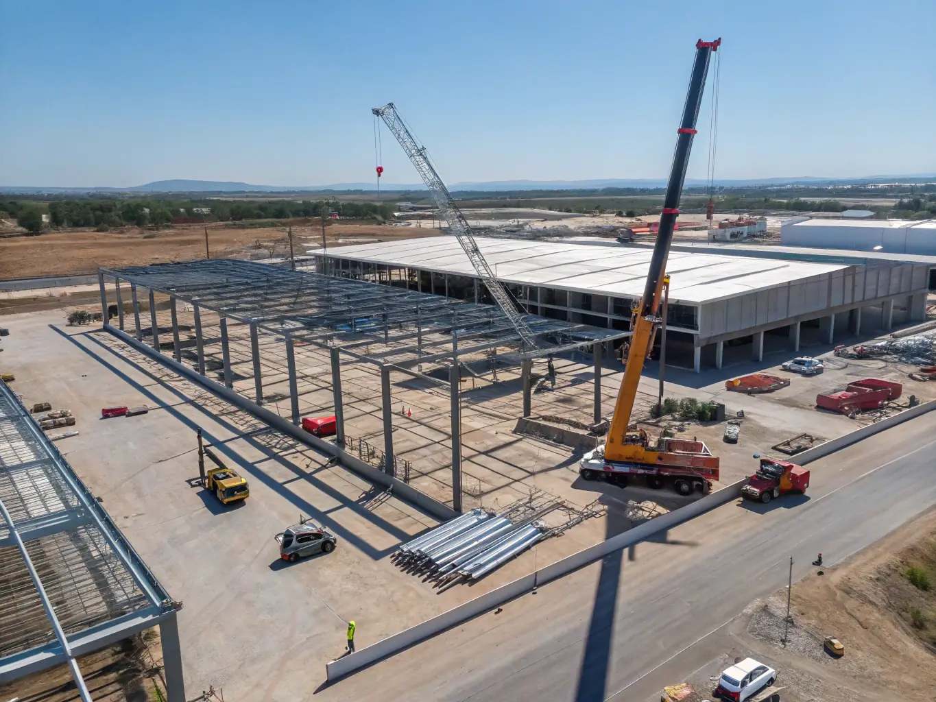 A wide shot of a newly constructed industrial warehouse facility, highlighting its large scale and durable design.